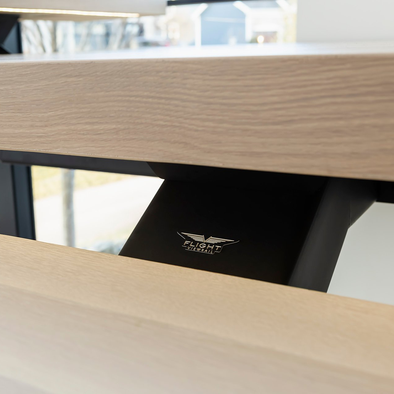 Small gap between open riser treads on floating staircase built to account for the 4 inch sphere rule