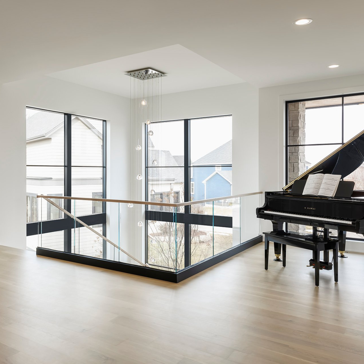 Second floor landing with glass base rail