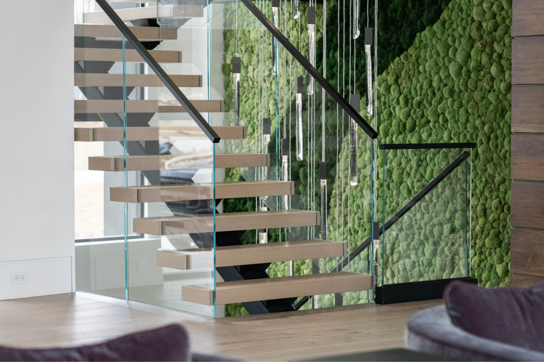 Vedera glass railing with a black cap rail installed on a FLIGHT Mono system.