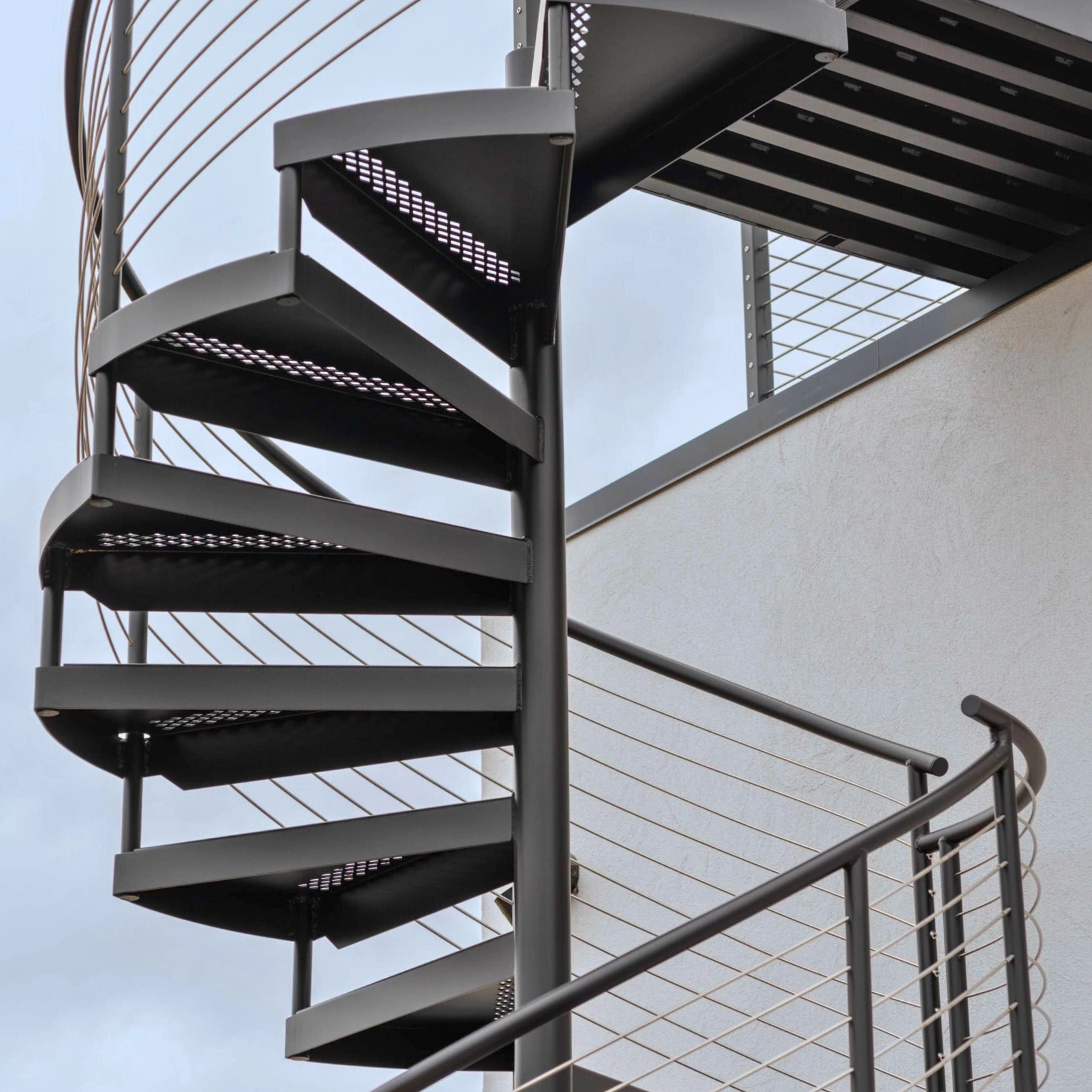 An all-metal exterior FLIGHT Spiral climbs the outside of a Hamptons home.