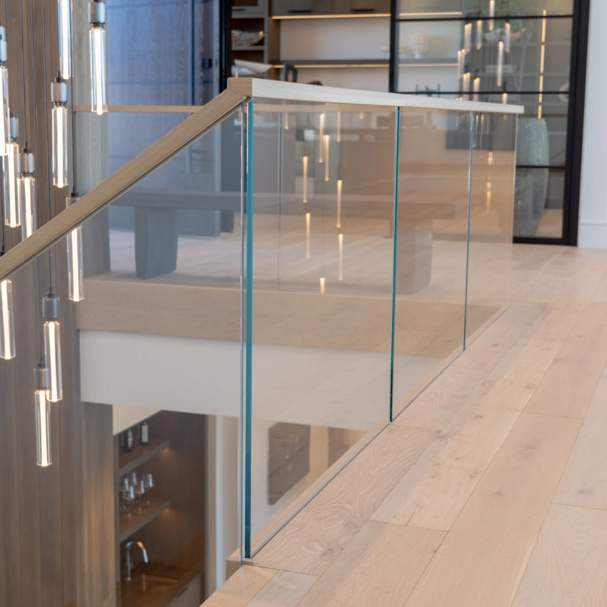 A shot of an overlook showing fascia and flooring around a Hidden Side Mount glass railing system.