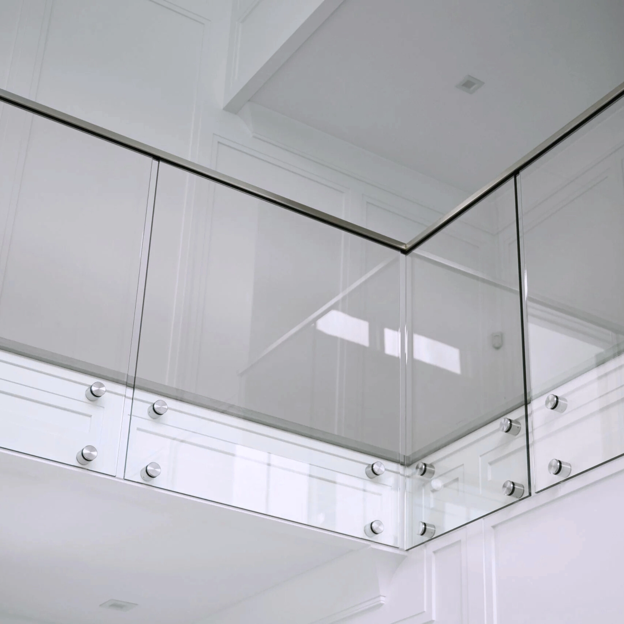 A modern balcony with a stainless steel Standoff Pins glass system.