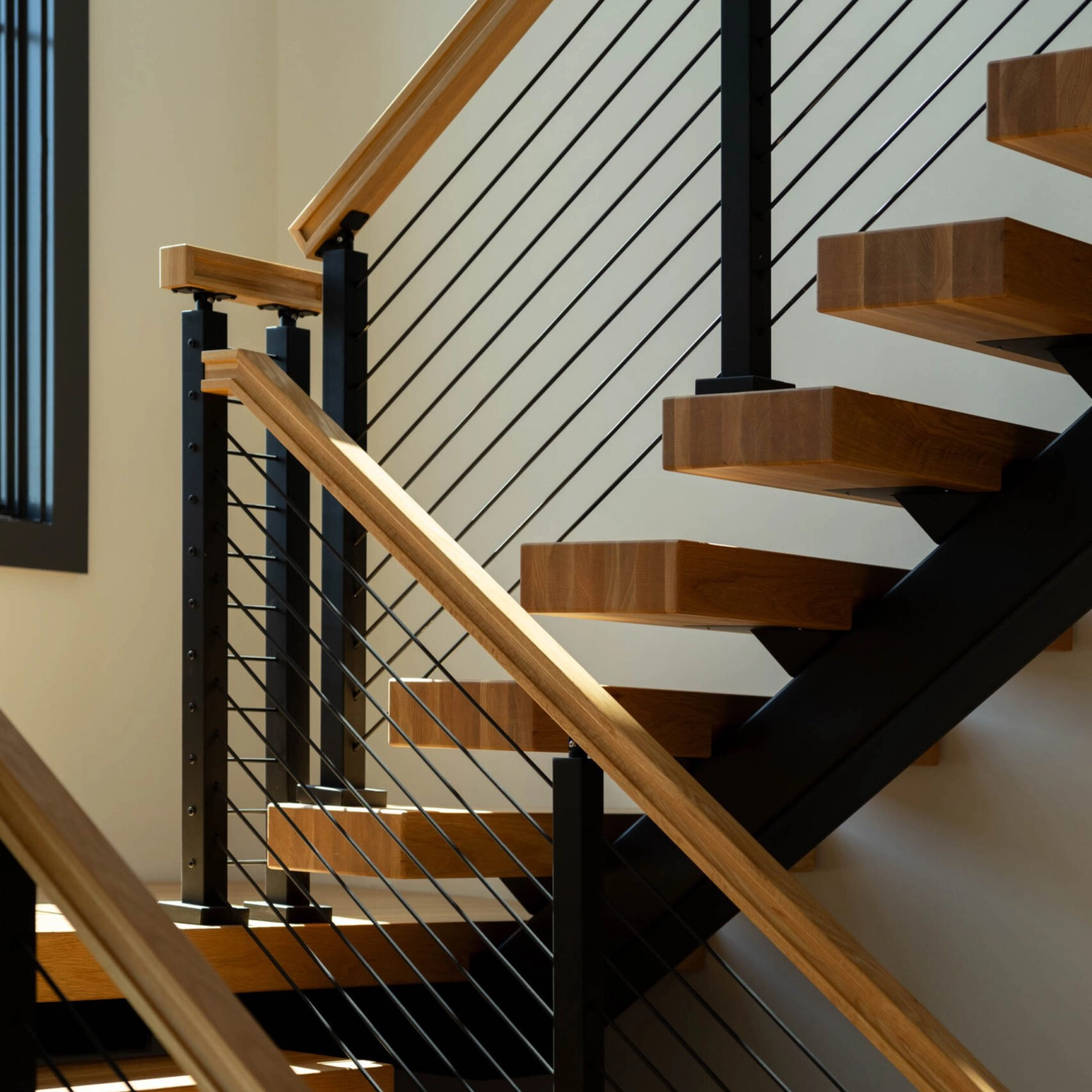 Signature Cable Railing on a switchback FLIGHT Mono staircase.